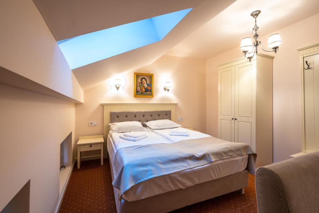 Postel nebo postele na pokoji v ubytování Apartament Hotel H