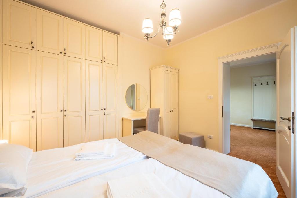 Postel nebo postele na pokoji v ubytování Apartament Hotel H