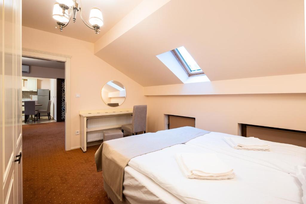 Postel nebo postele na pokoji v ubytování Apartament Hotel H