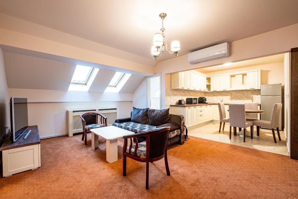 Kuchyň nebo kuchyňský kout v ubytování Apartament Hotel H