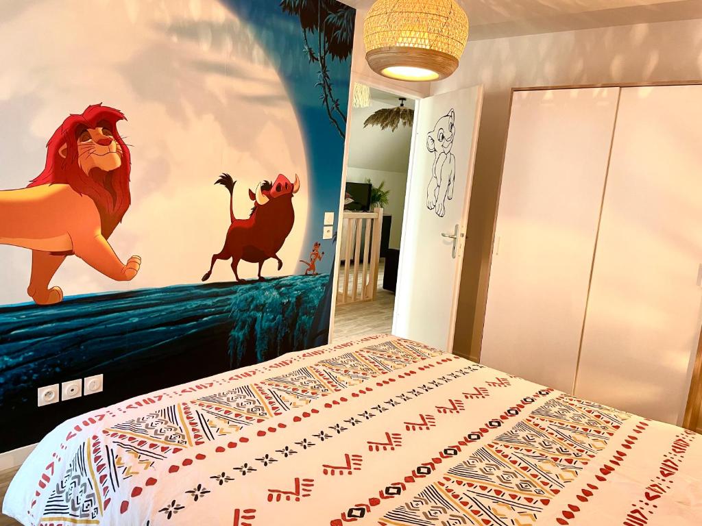 a bedroom with a bed with a lion painted on the wall at Bel appartement « The Lion King » proche Disney in Montévrain