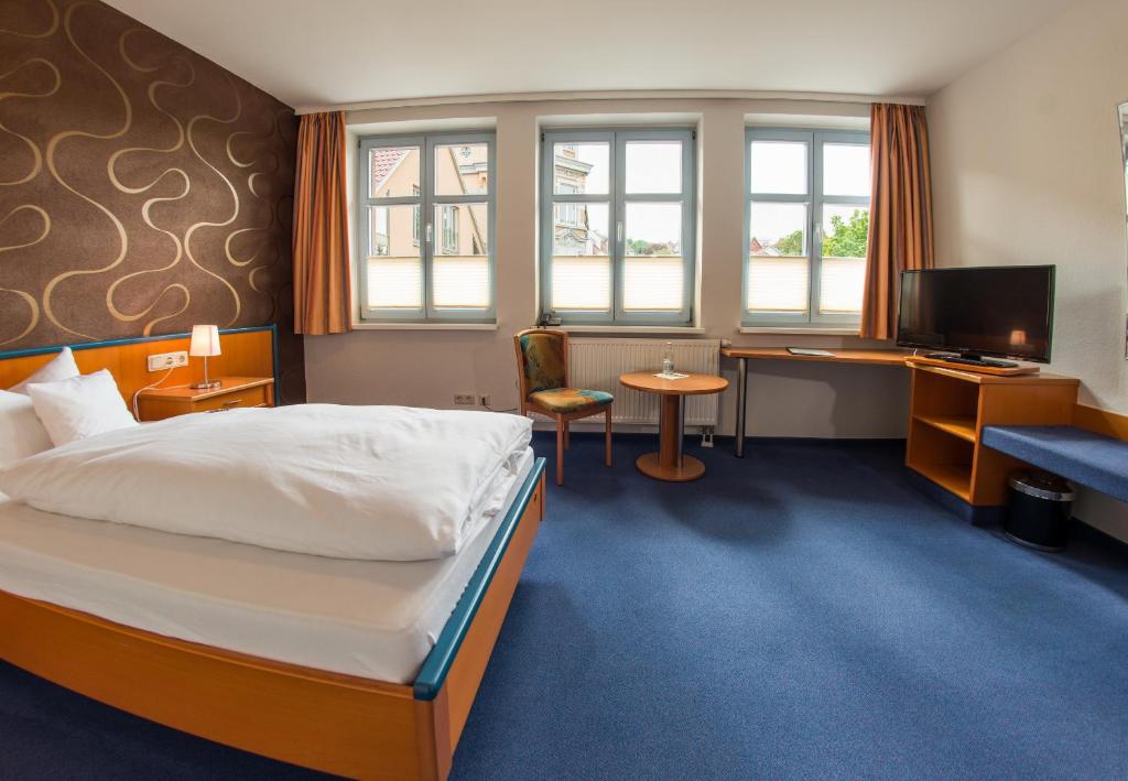 Postel nebo postele na pokoji v ubytování B&S Hotel Am Bachhaus