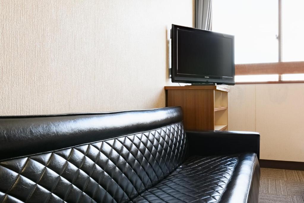 TV a/nebo společenská místnost v ubytování Tabist HotelNakajima Fuji