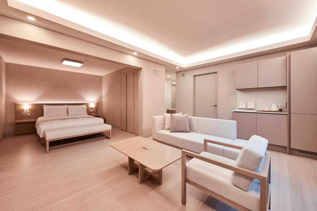 Postel nebo postele na pokoji v ubytování Tops10 Resort Donggang Cistar