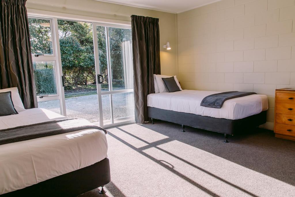 Postel nebo postele na pokoji v ubytování Flaxbourne Motels