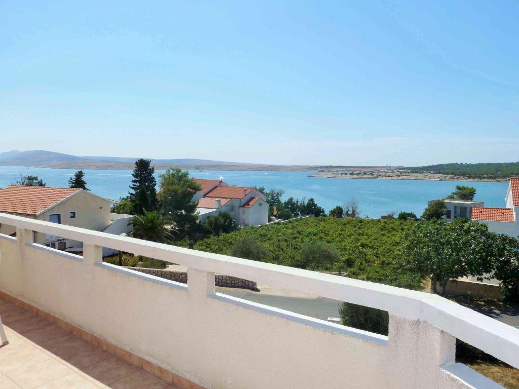 a view of the water from the balcony of a house at Apartments Donadic I, Caska in Novalja