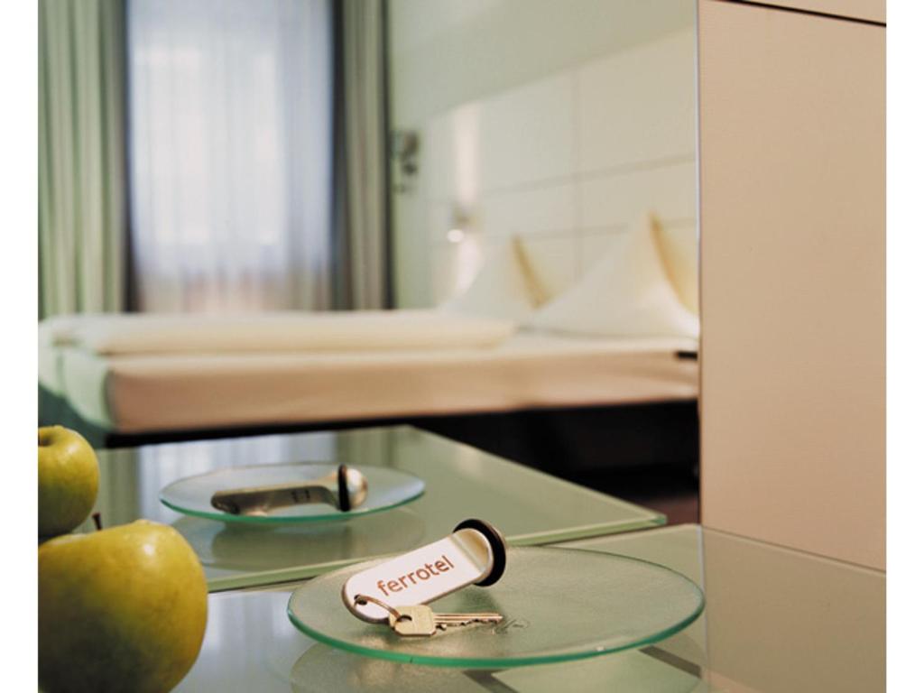 a hospital room with two apples on a table at Ferrotel Duisburg - Partner of SORAT Hotels in Duisburg