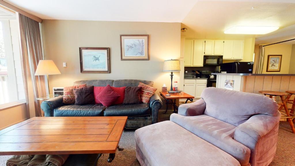 a living room with a couch and a coffee table at Crestview #25 condo in Mammoth Lakes