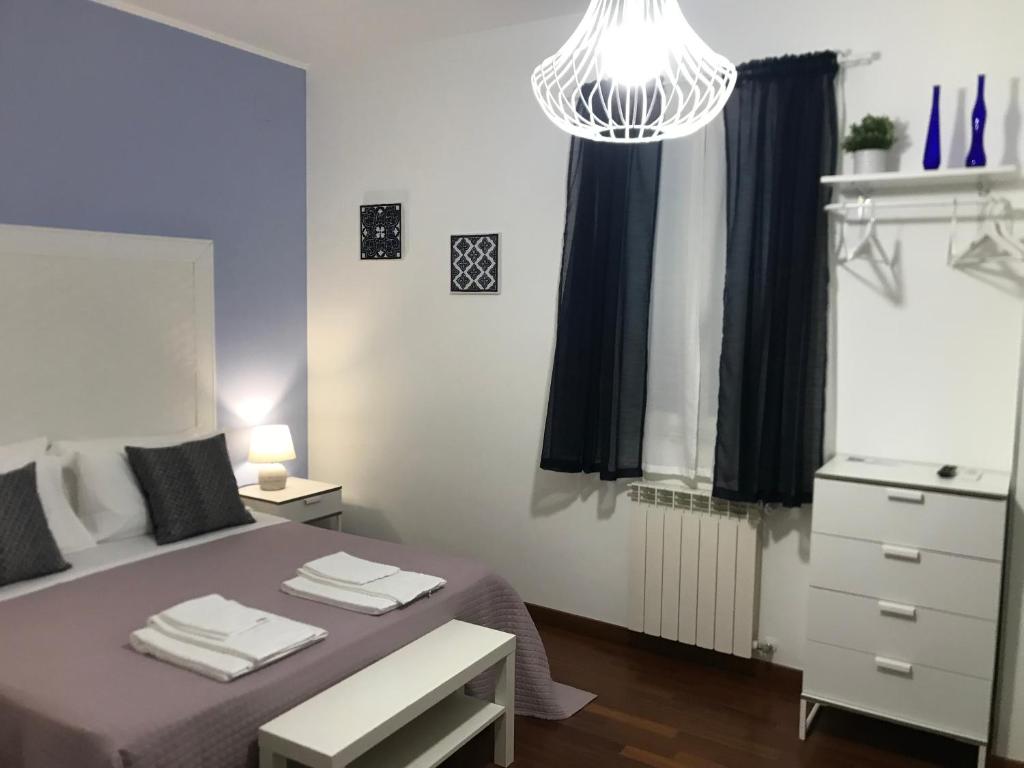 Postel nebo postele na pokoji v ubytování BeB L'ALLORO