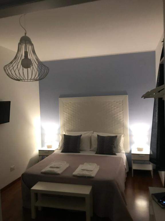 Postel nebo postele na pokoji v ubytování BeB L'ALLORO