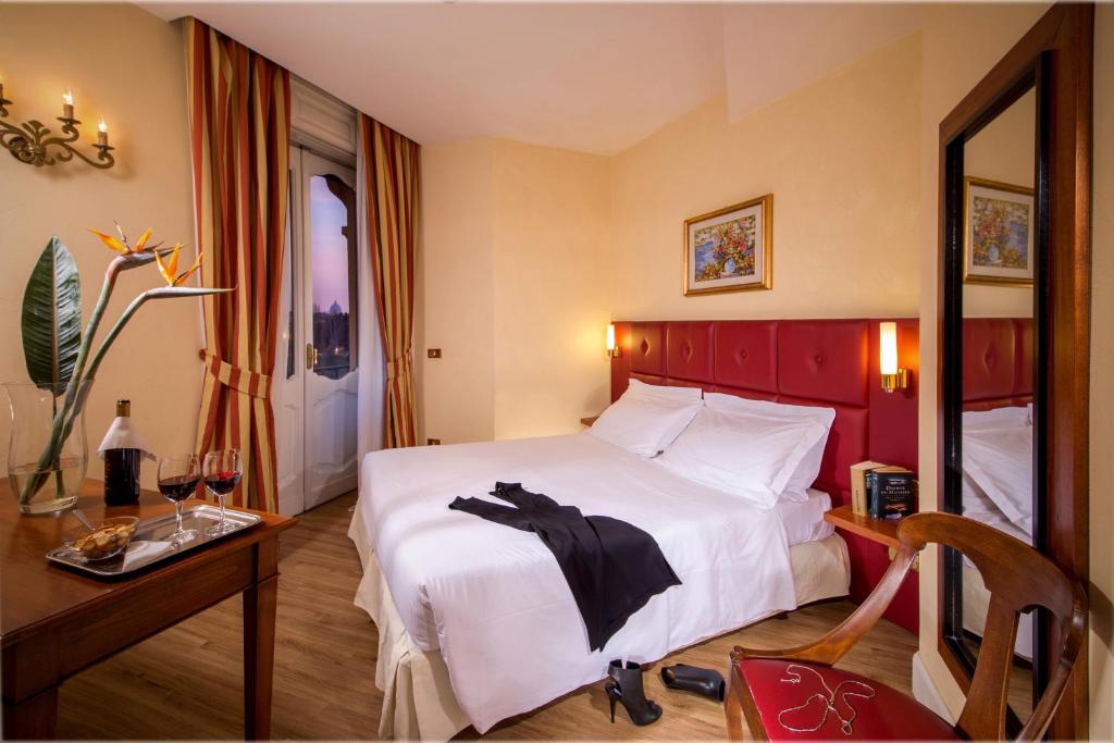 Ein Bett oder Betten in einem Zimmer der Unterkunft Best Western Hotel Astrid