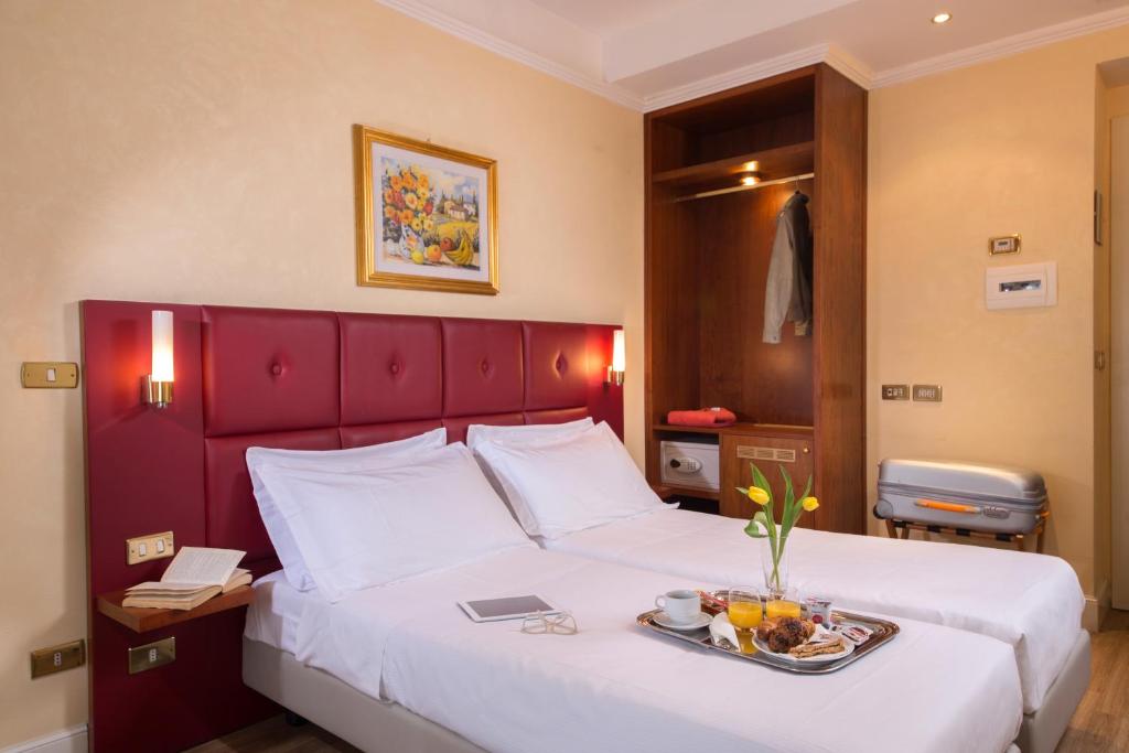 Ein Bett oder Betten in einem Zimmer der Unterkunft Best Western Hotel Astrid