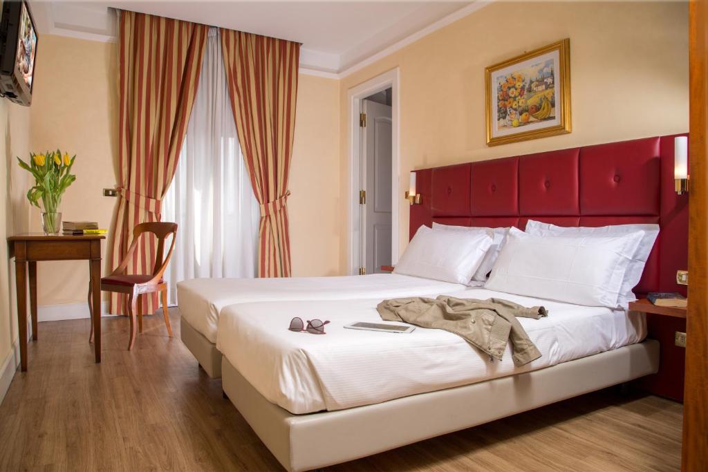 Ein Bett oder Betten in einem Zimmer der Unterkunft Best Western Hotel Astrid