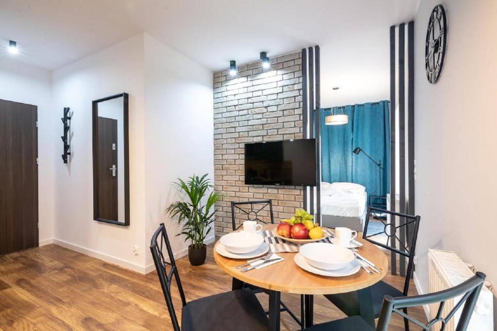 Televízia a/alebo spoločenská miestnosť v ubytovaní Nice Apartments