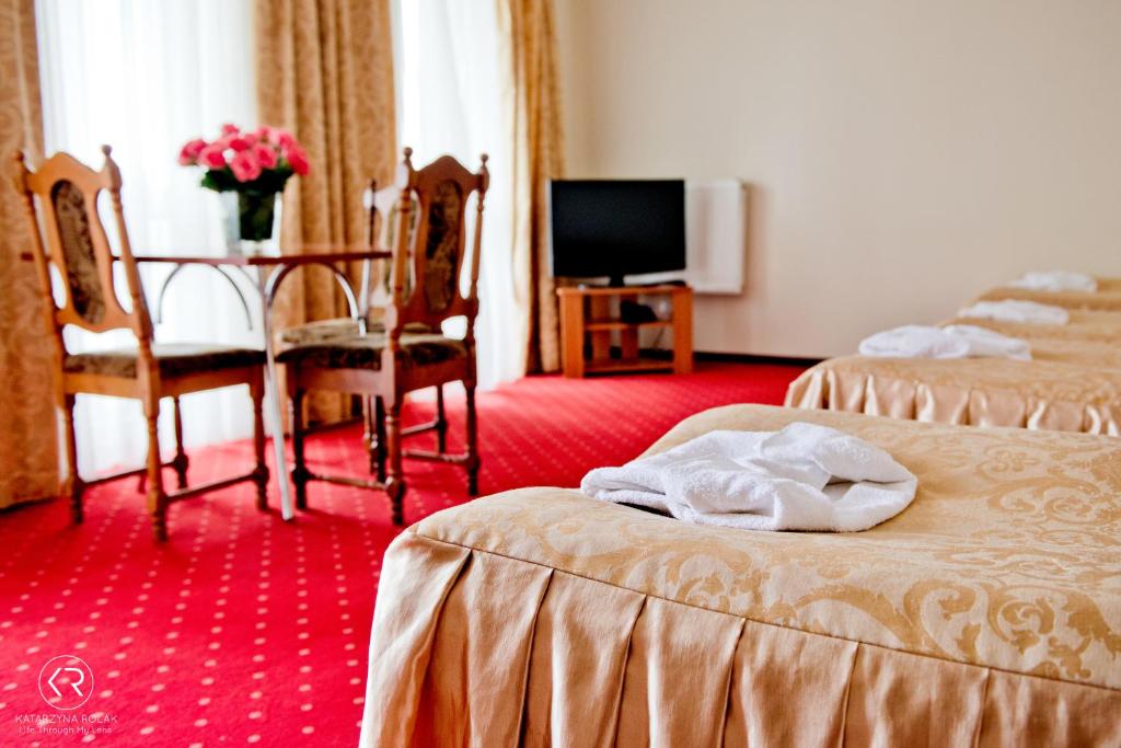 Postel nebo postele na pokoji v ubytování Hotel Groman
