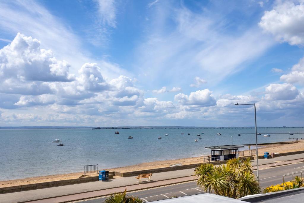 a view of a beach with boats in the water at Roslin Beach Hotel in Southend-on-Sea