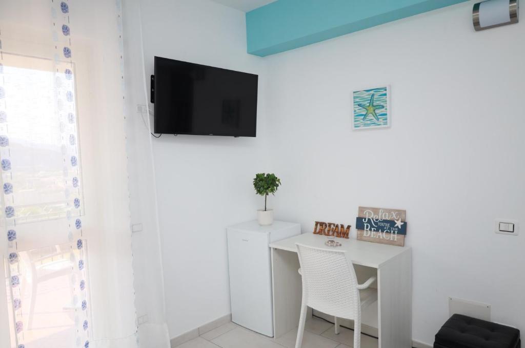 Televízia a/alebo spoločenská miestnosť v ubytovaní B&B Torre Nave