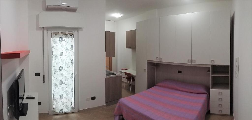 Posteľ alebo postele v izbe v ubytovaní Seaside Apartment - Casa Vacanze a 50mt dal mare