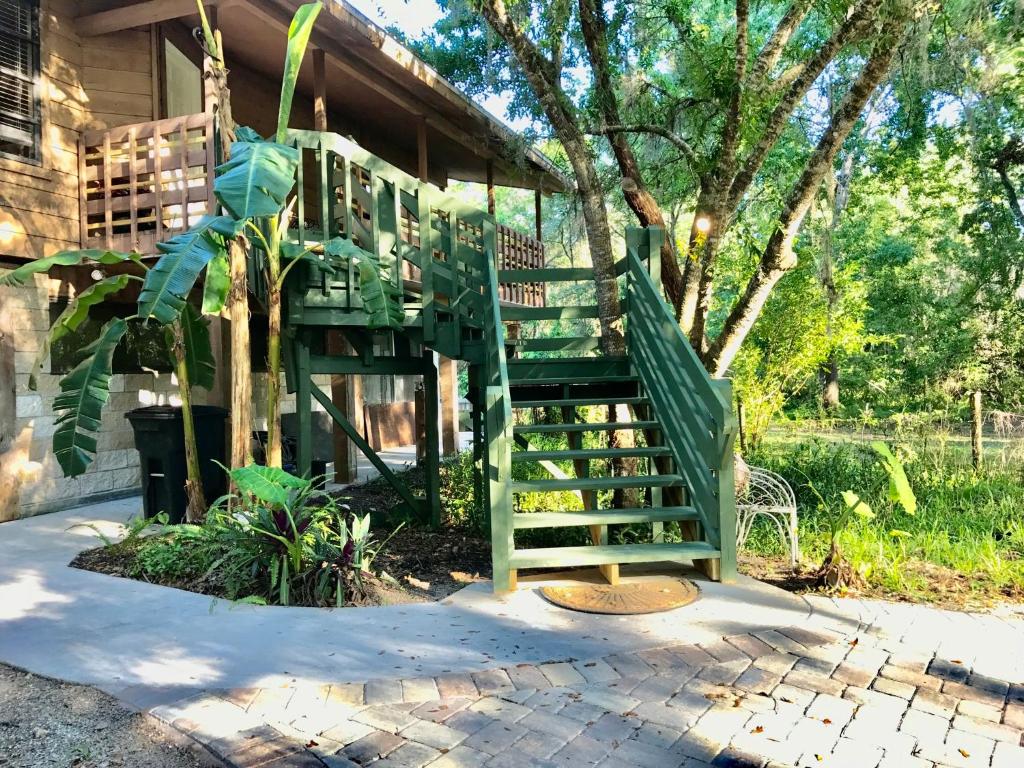 a green staircase leading up to a house at º Tropical Escape Sarasota º Experience Florida Up-close! in Sarasota