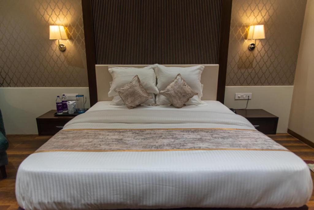 Postel nebo postele na pokoji v ubytování Hotel Royal Livin