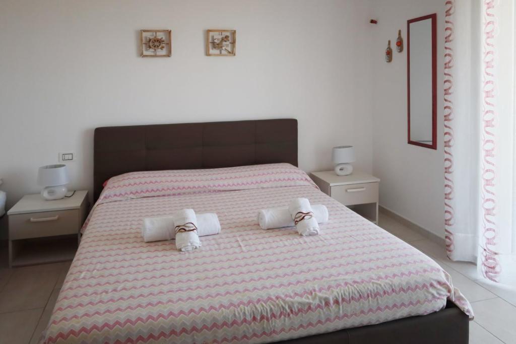 Posteľ alebo postele v izbe v ubytovaní B&B Torre Nave