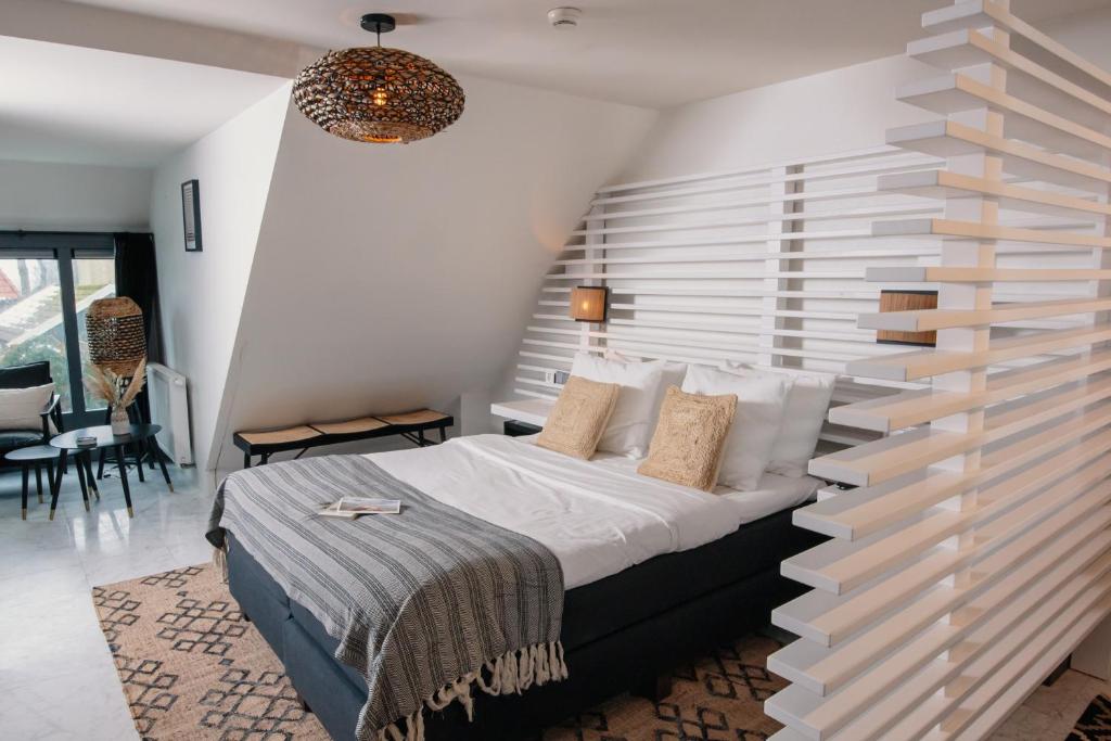 Postel nebo postele na pokoji v ubytování Nobel Hotel Ameland