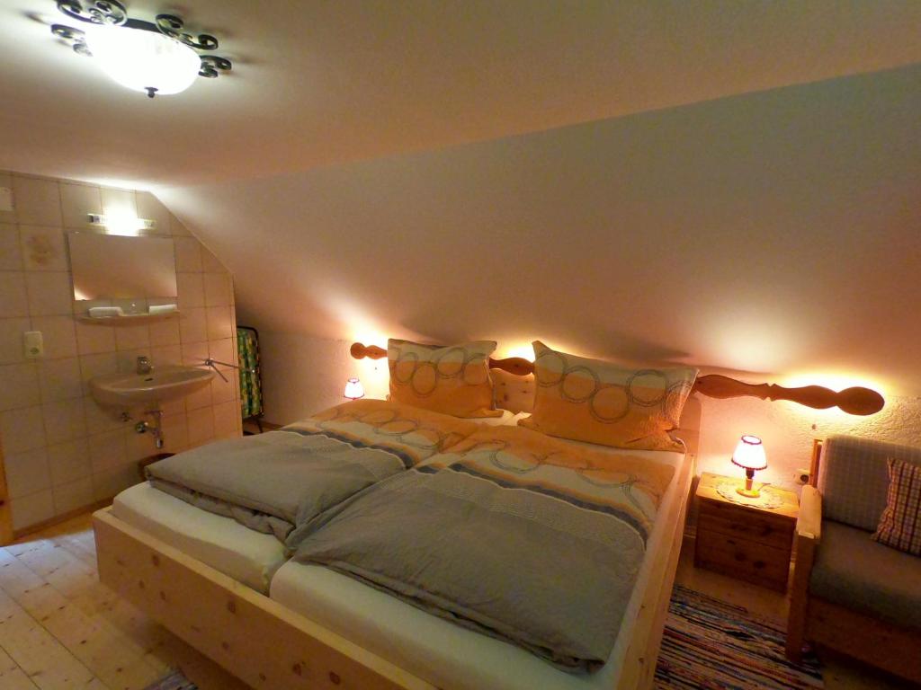 A bed or beds in a room at Alpenhaus Ganser-Dixit