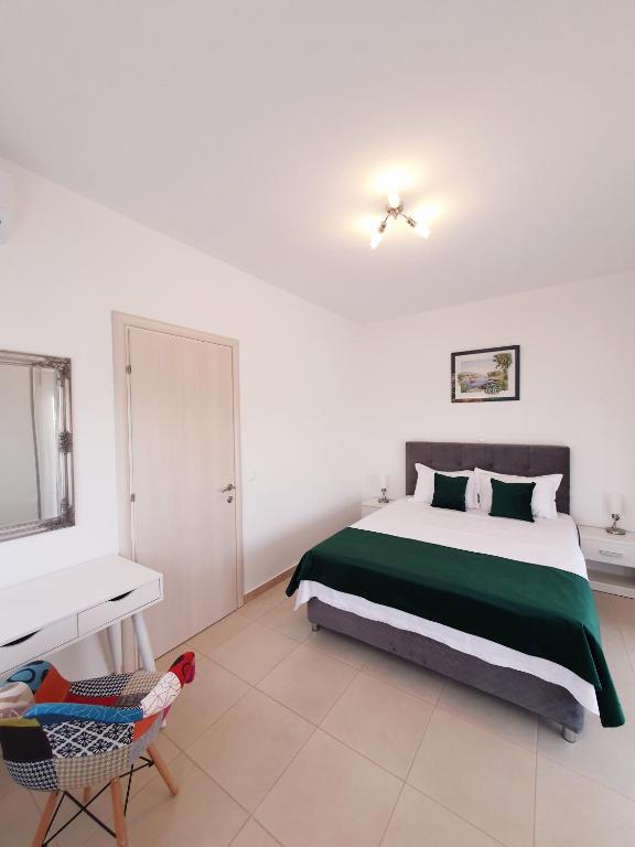 Posteľ alebo postele v izbe v ubytovaní Bella House Nikiti
