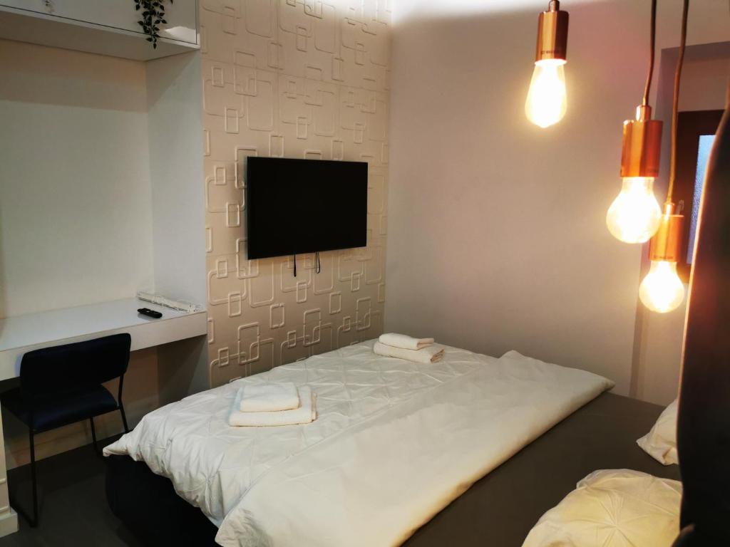 Posteľ alebo postele v izbe v ubytovaní Apartment and Rooms Marinac