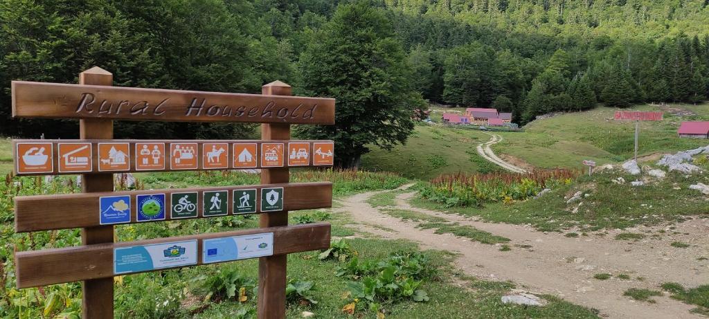 a sign for a hiking trail in the mountains at Dulović - KATUN POTOCI in Kolašin