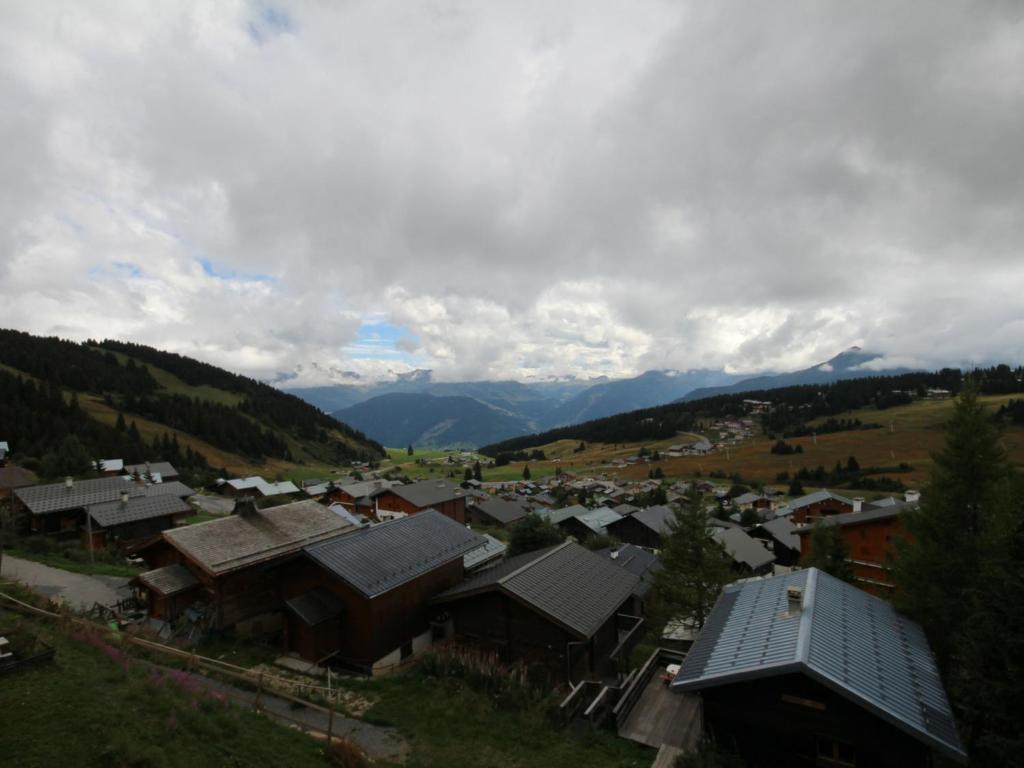 a small town in a valley with mountains at Appartement Les Saisies, 3 pièces, 6 personnes - FR-1-293-80 in Les Saisies