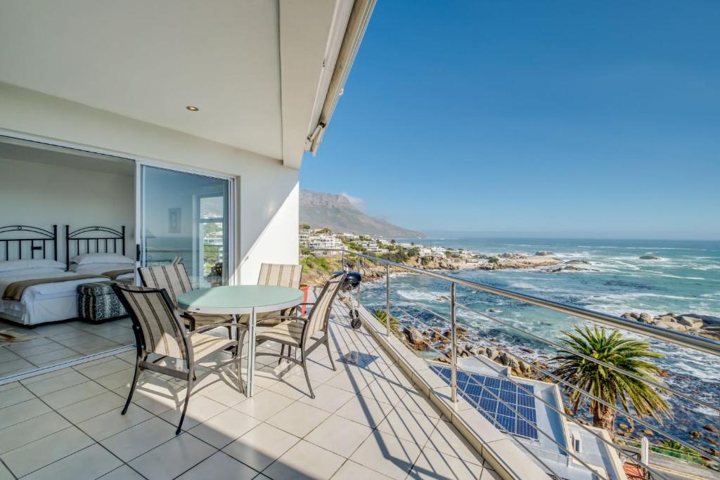 a balcony with a view of the ocean at Camps Bay Terrace Penthouse in Cape Town
