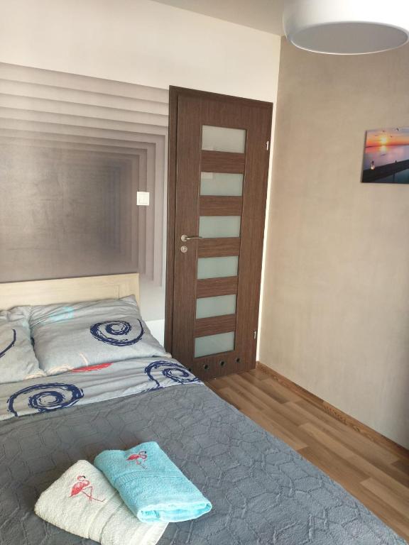 Posteľ alebo postele v izbe v ubytovaní Apartament Tiffany
