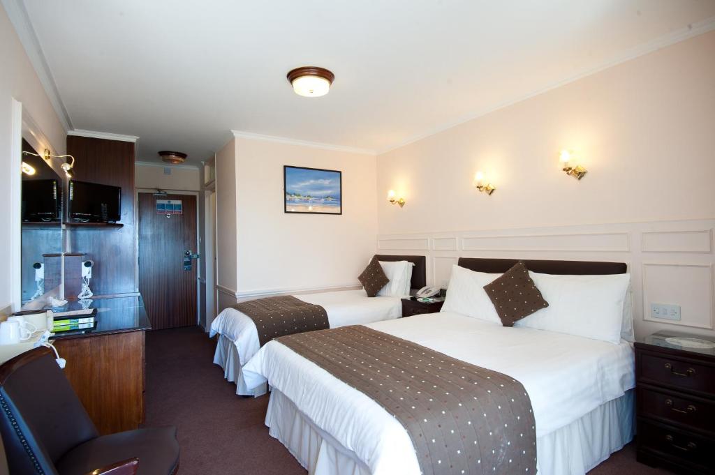 Postel nebo postele na pokoji v ubytování Pontac House Hotel