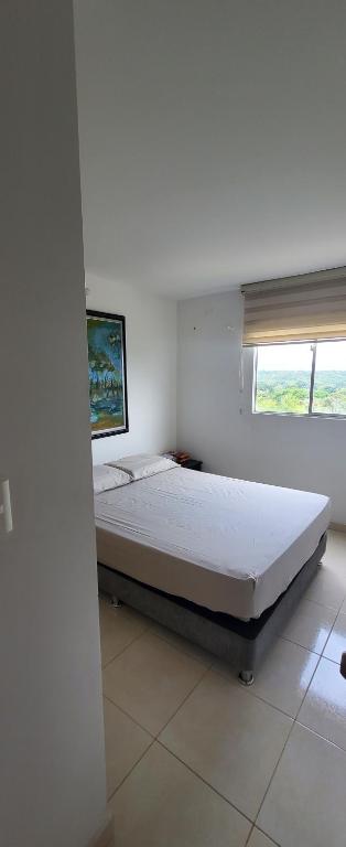 Postel nebo postele na pokoji v ubytování LINDO APARTAMENTO AMOBLADO, Norte de Neiva