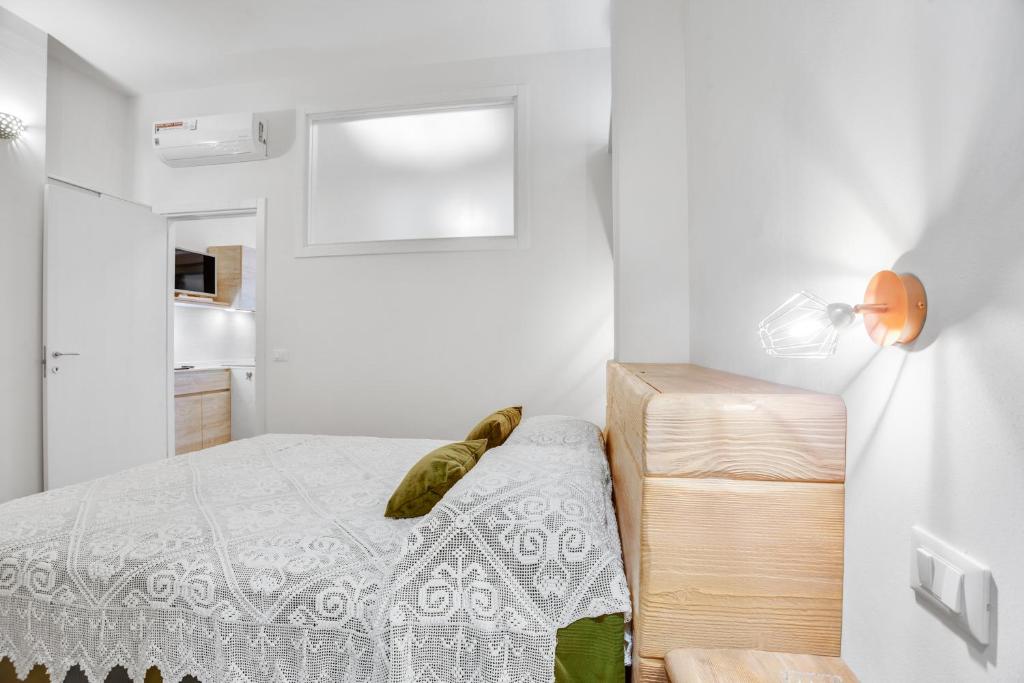 A bed or beds in a room at MADAME BARI' Suite Apt in the heart of Bari