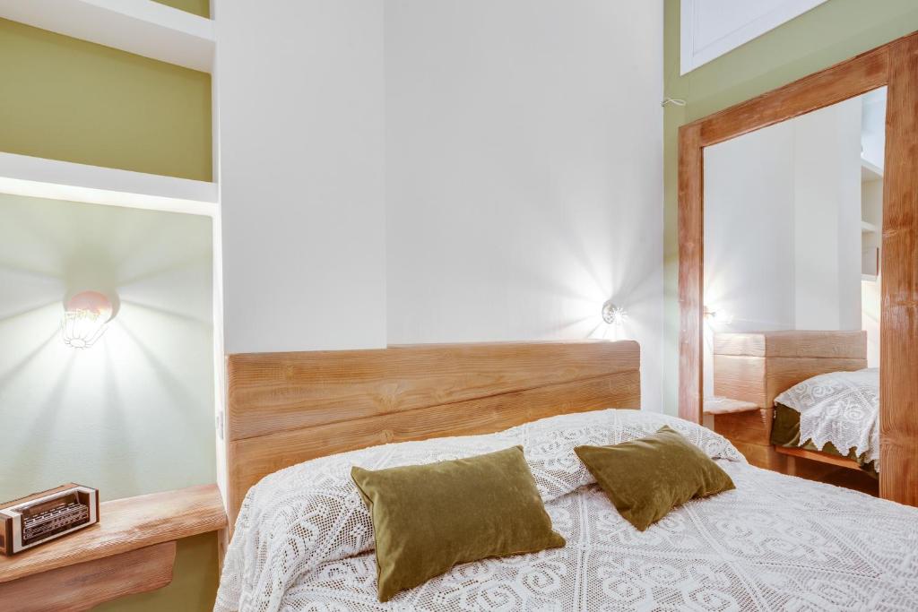 A bed or beds in a room at MADAME BARI' Suite Apt in the heart of Bari