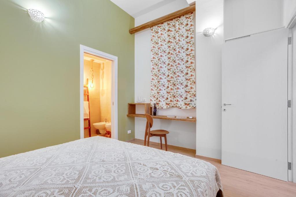 A bed or beds in a room at MADAME BARI' Suite Apt in the heart of Bari