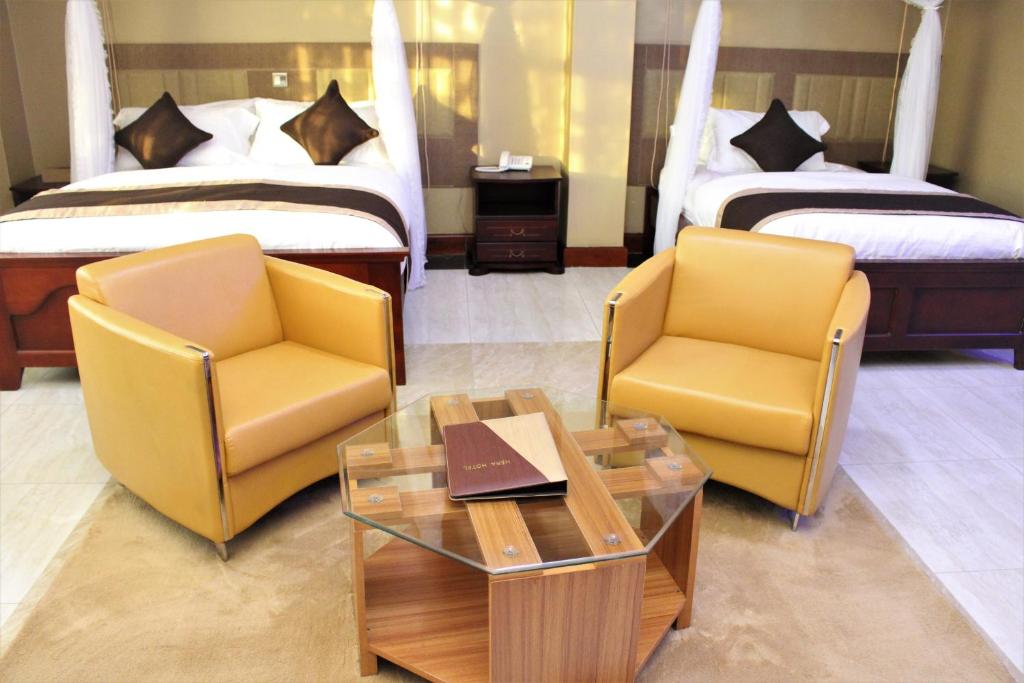 Postel nebo postele na pokoji v ubytování Hera Hotel Kampala
