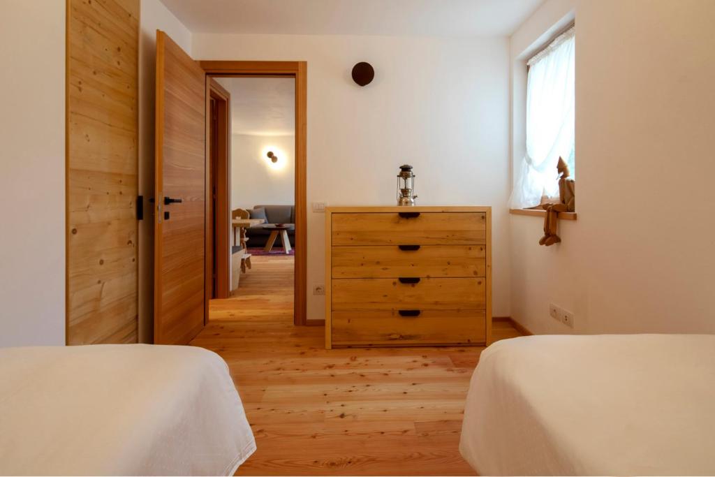Ένα ή περισσότερα κρεβάτια σε δωμάτιο στο Chalet del Capriolo