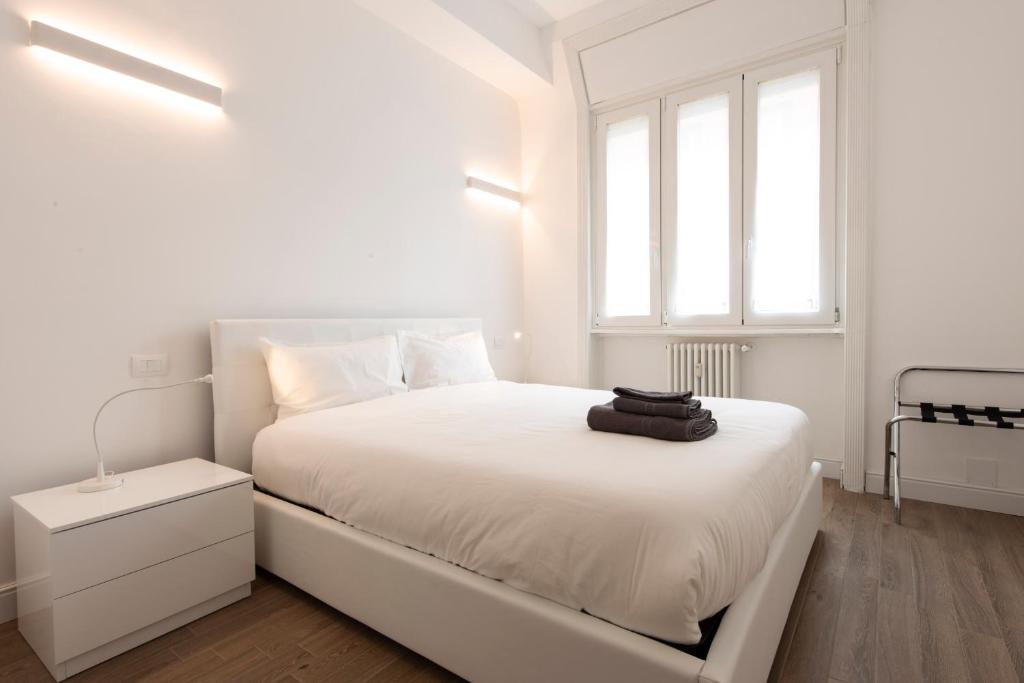 A bed or beds in a room at Gaffurio Apartments