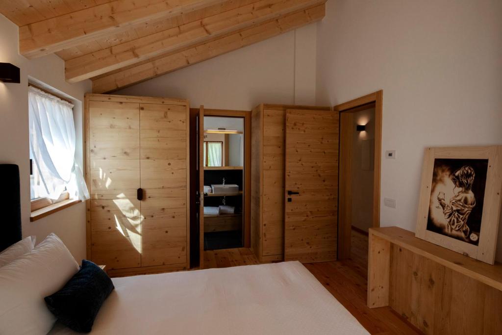 Ένα ή περισσότερα κρεβάτια σε δωμάτιο στο Chalet del Capriolo