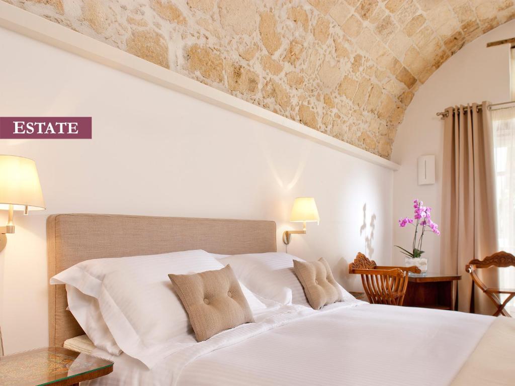 Posteľ alebo postele v izbe v ubytovaní Rimondi Boutique Hotel - Small Luxury Hotels of the World
