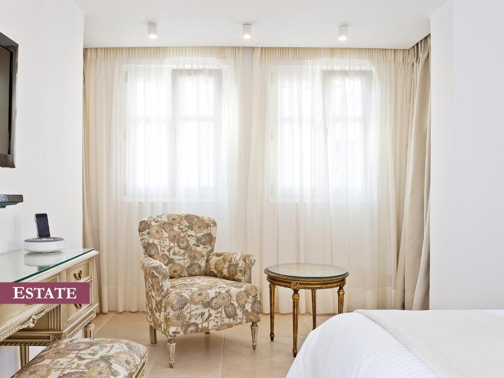 Televízia a/alebo spoločenská miestnosť v ubytovaní Rimondi Boutique Hotel - Small Luxury Hotels of the World