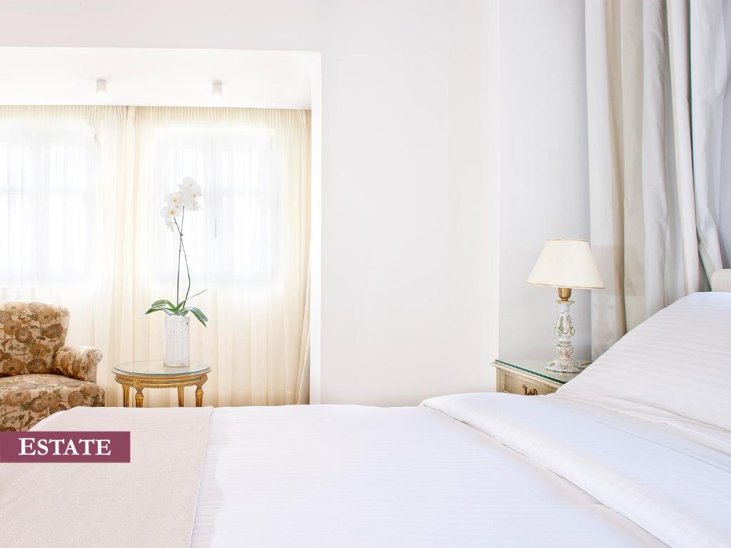 Posteľ alebo postele v izbe v ubytovaní Rimondi Boutique Hotel - Small Luxury Hotels of the World