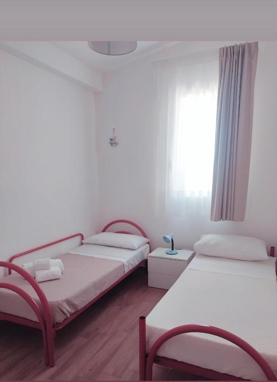 Postel nebo postele na pokoji v ubytování Residence La Perla Marzamemi