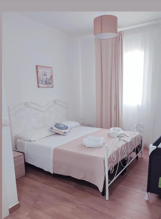 Postel nebo postele na pokoji v ubytování Residence La Perla Marzamemi