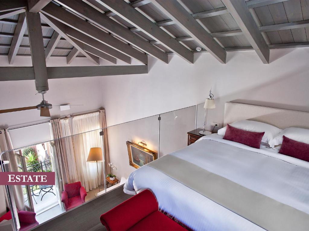 Posteľ alebo postele v izbe v ubytovaní Rimondi Boutique Hotel - Small Luxury Hotels of the World