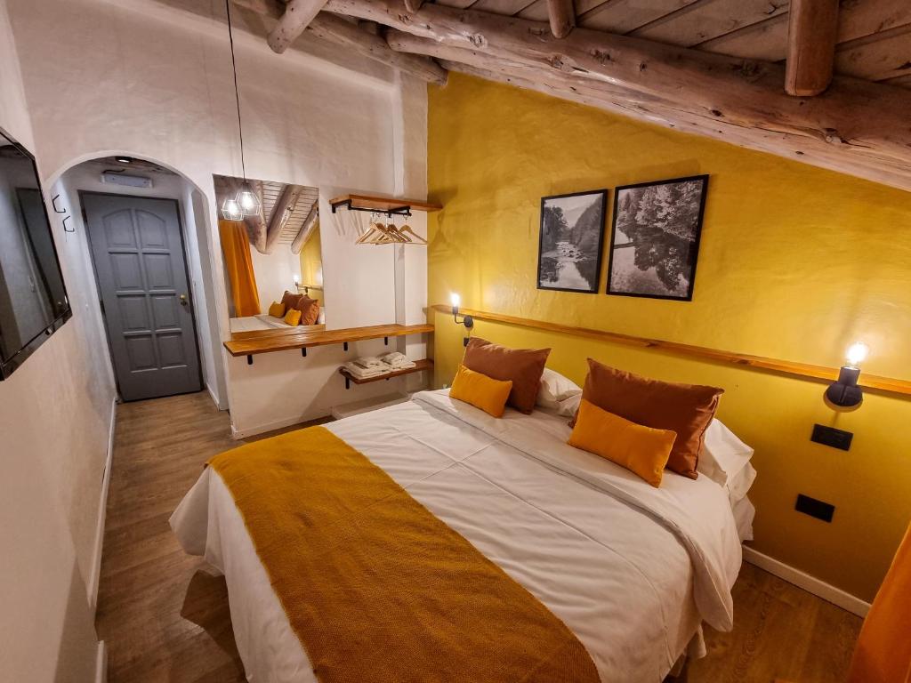 Postel nebo postele na pokoji v ubytování Hosteria Las Lucarnas