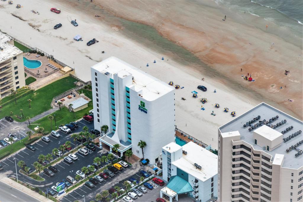 an aerial view of a beach and buildings at Holiday Inn Express & Suites Oceanfront Daytona Beach Shores, an IHG Hotel in Daytona Beach